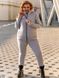 Жіночий утеплений спортивний однотонний костюм трійка кофта+штани+жилетка з трикотажної тканини з начосом колір світло-сірий розміри 50-52, 54-56