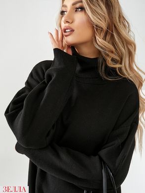 Подовжена сукня-светр в універсальному розмірі 42-46, колір чорний.