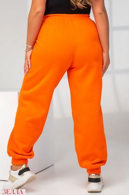 Спортивні штани з начосом помаранчевого кольору, в розмірі 50-52, 54-56.
