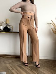 Трендові штани кльош кольору кемел, в розмірі 42-44, 46-48.